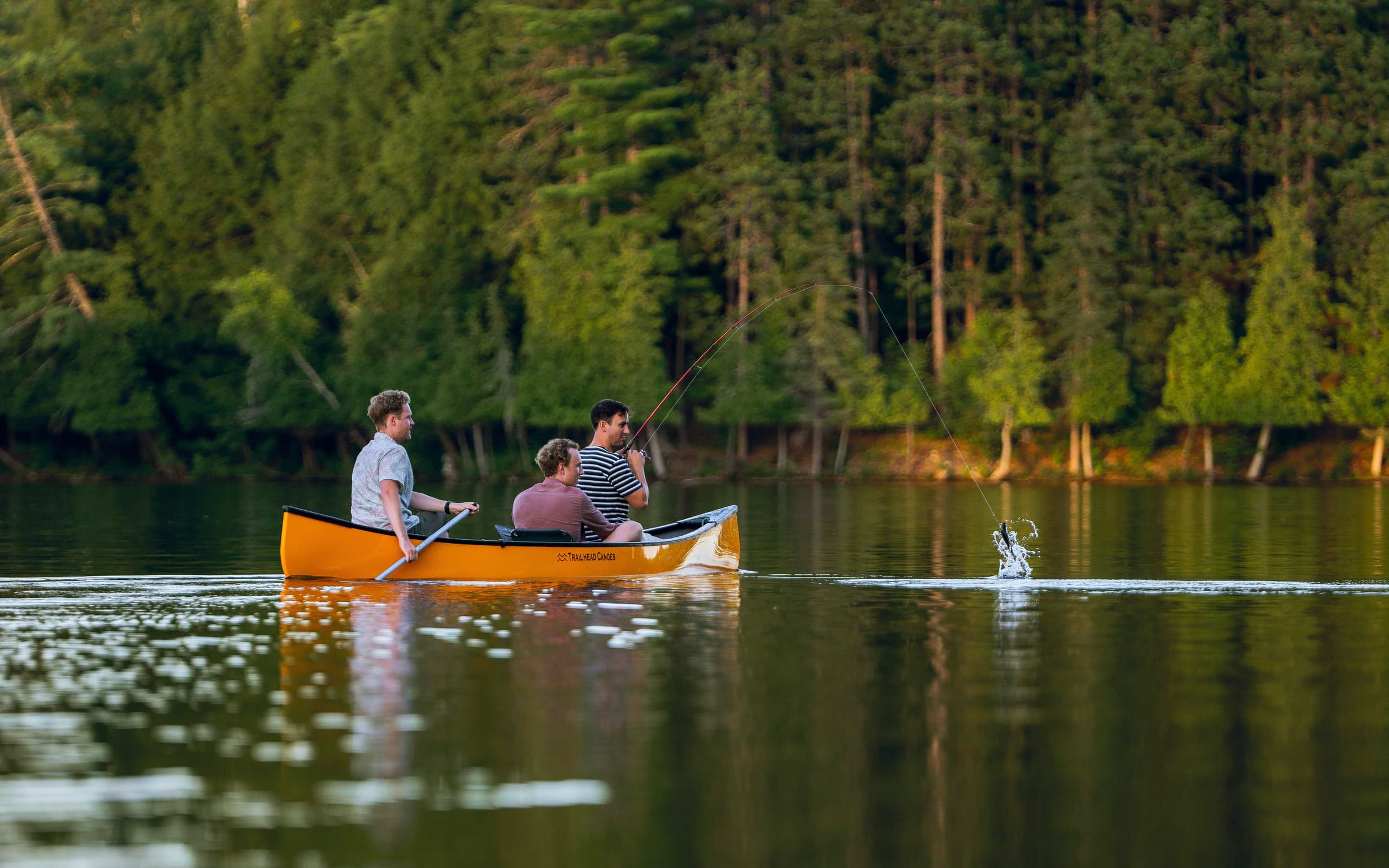 Man catches fish close to cottage